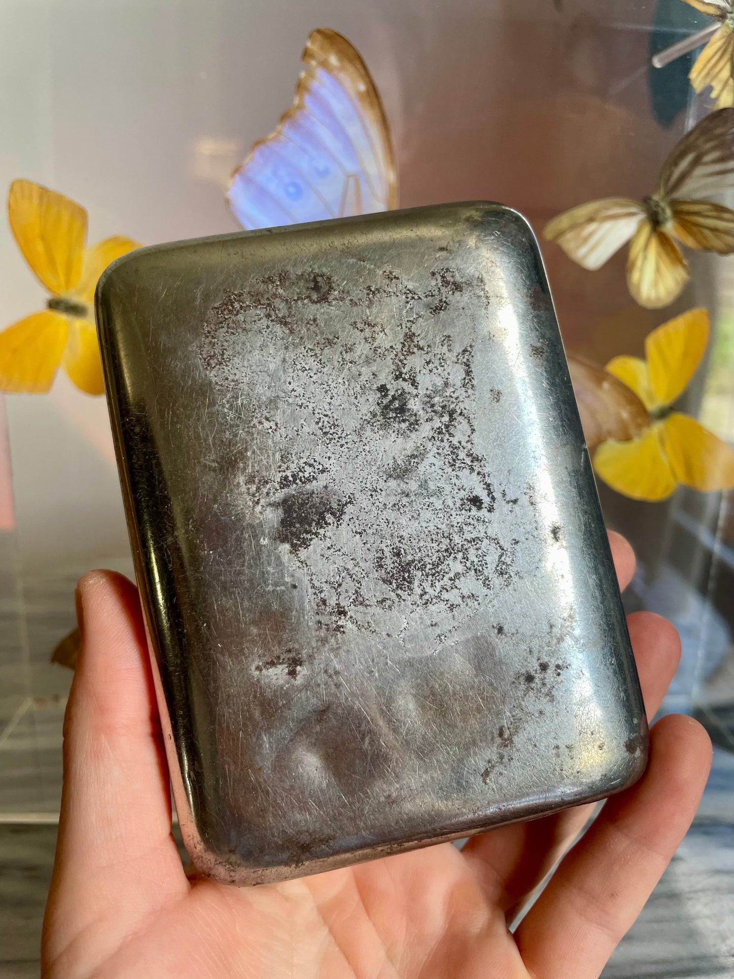 Antique tobacco tin with map of New Zealand engraved on the front