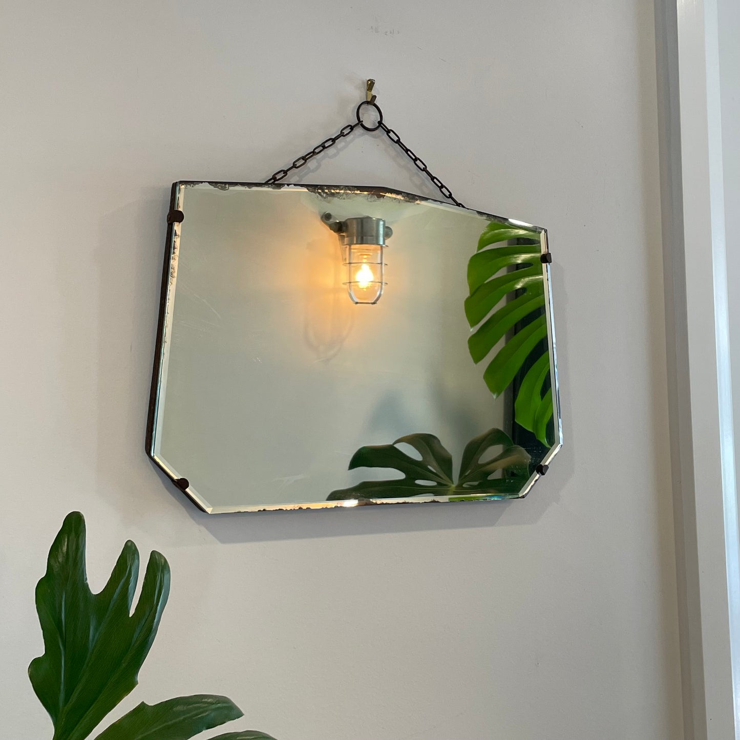 Antique frameless mirror with beveled edges and pointed top