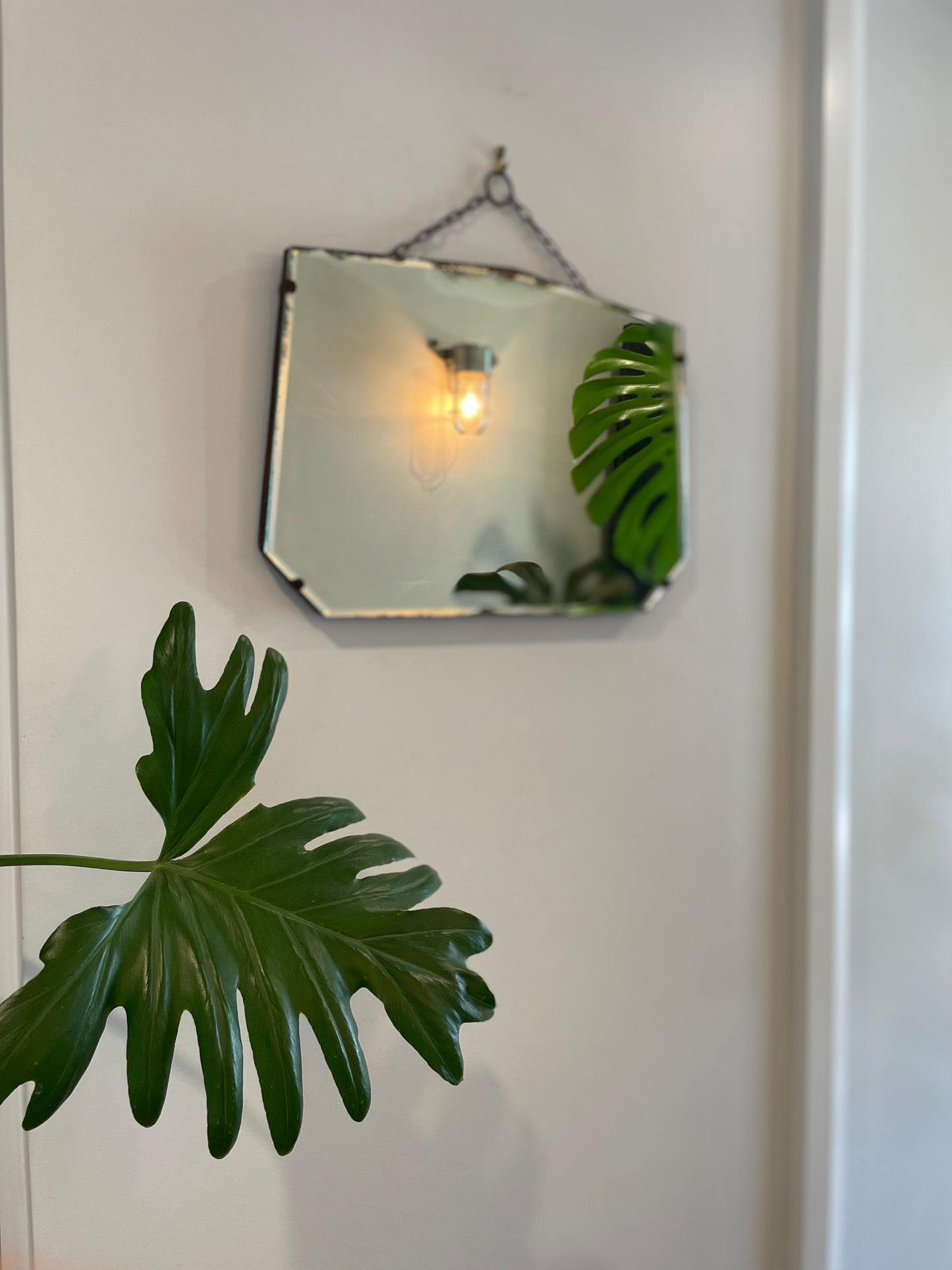 Antique frameless mirror with beveled edges and pointed top