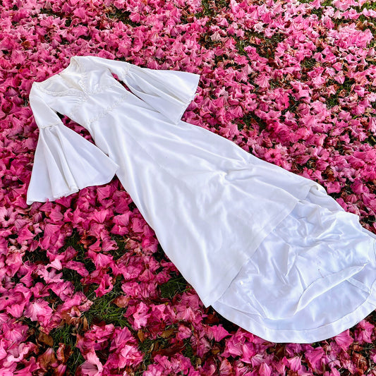 The Ophelia Dress - vintage 1970’s medieval style wedding dress with daisy chain details and bell sleeves