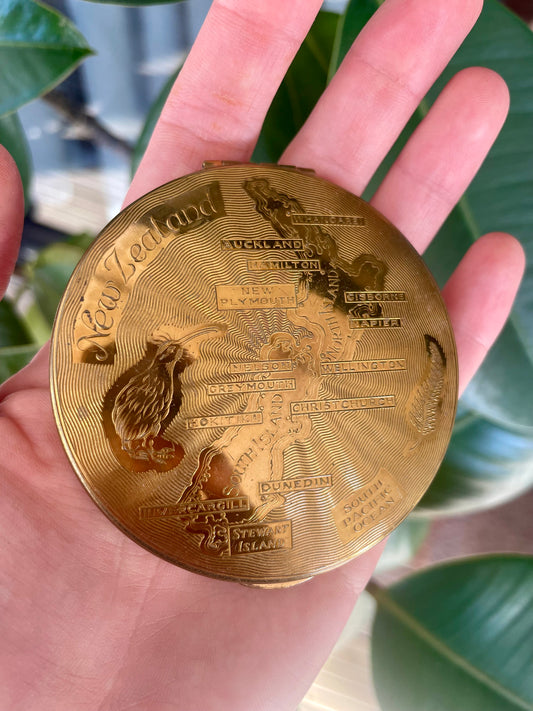 Antique brass compact mirror engraved with kiwi and map of New Zealand - souvenir makeup powder compact