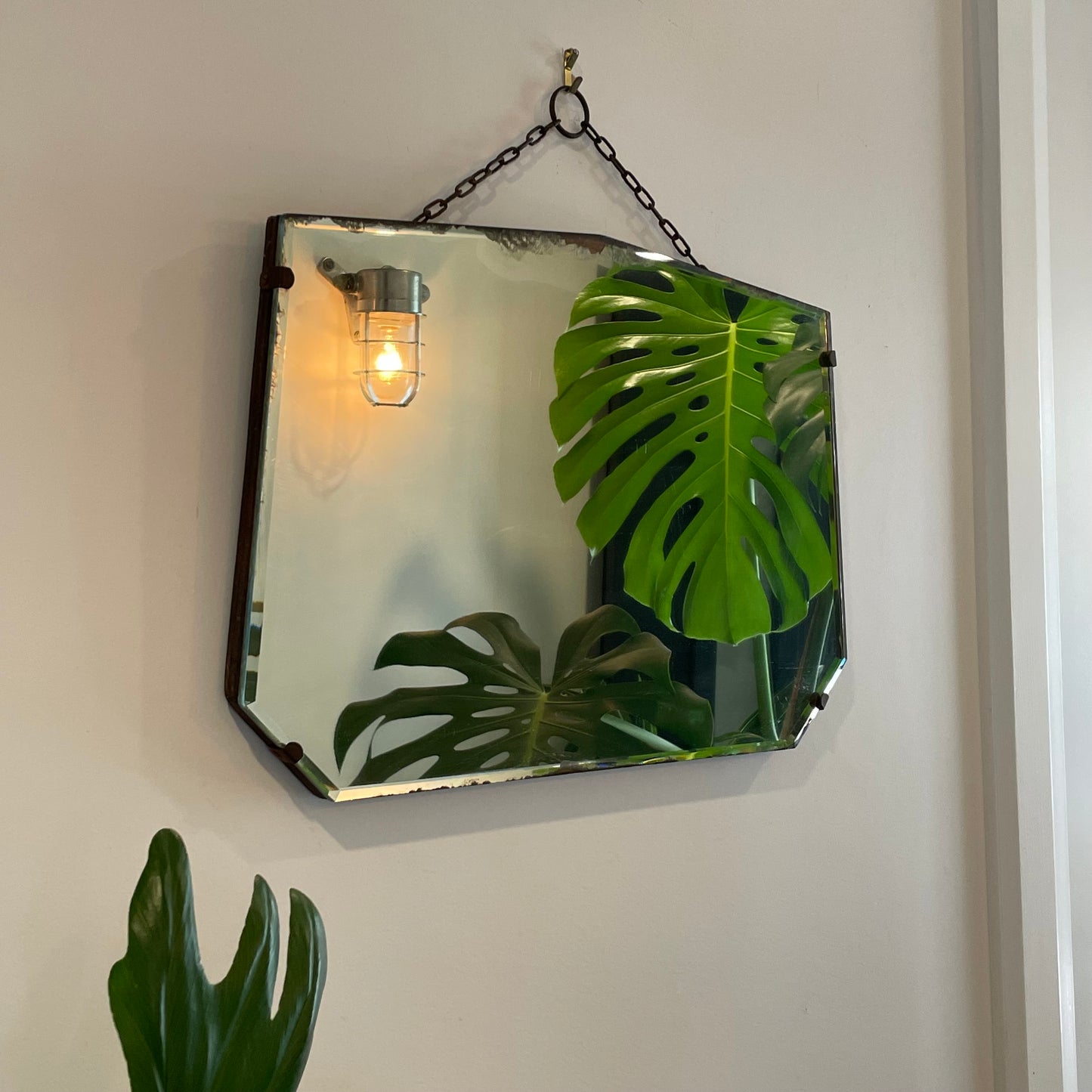 Antique frameless mirror with beveled edges and pointed top