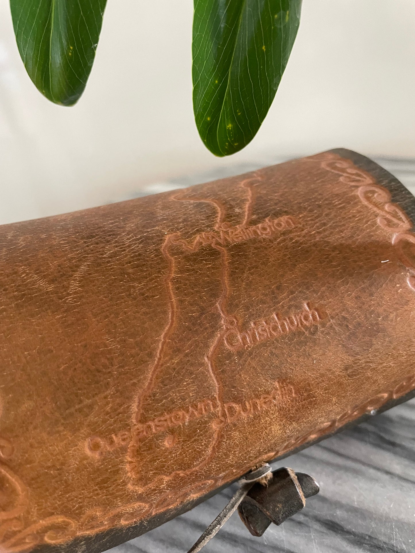 Vintage hand-tooled leather box with embossed Map of New Zealand and Māori designs