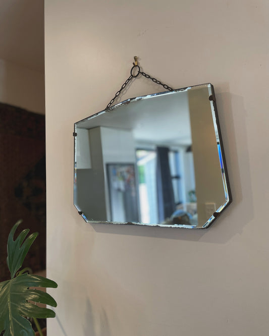 Antique frameless mirror with beveled edges and pointed top