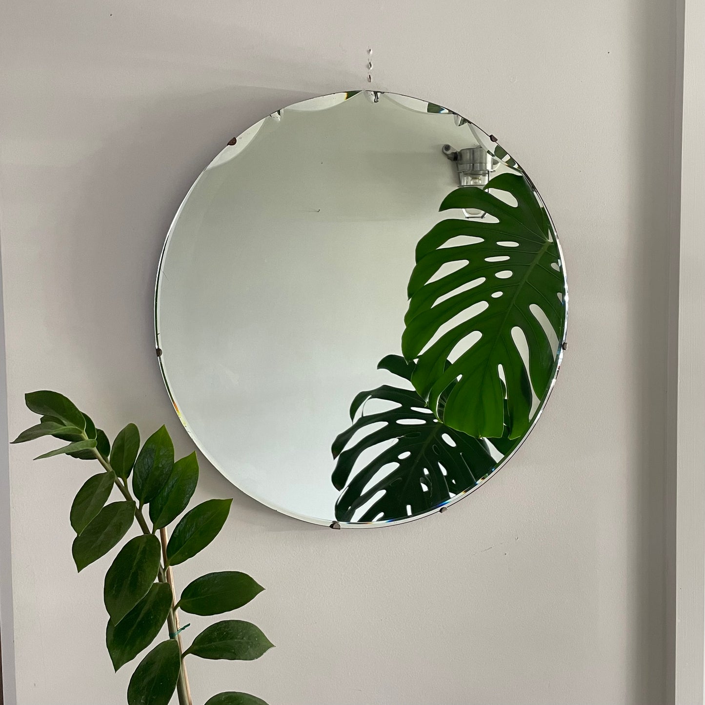 Large round antique Art Deco mirror with scalloped beveles