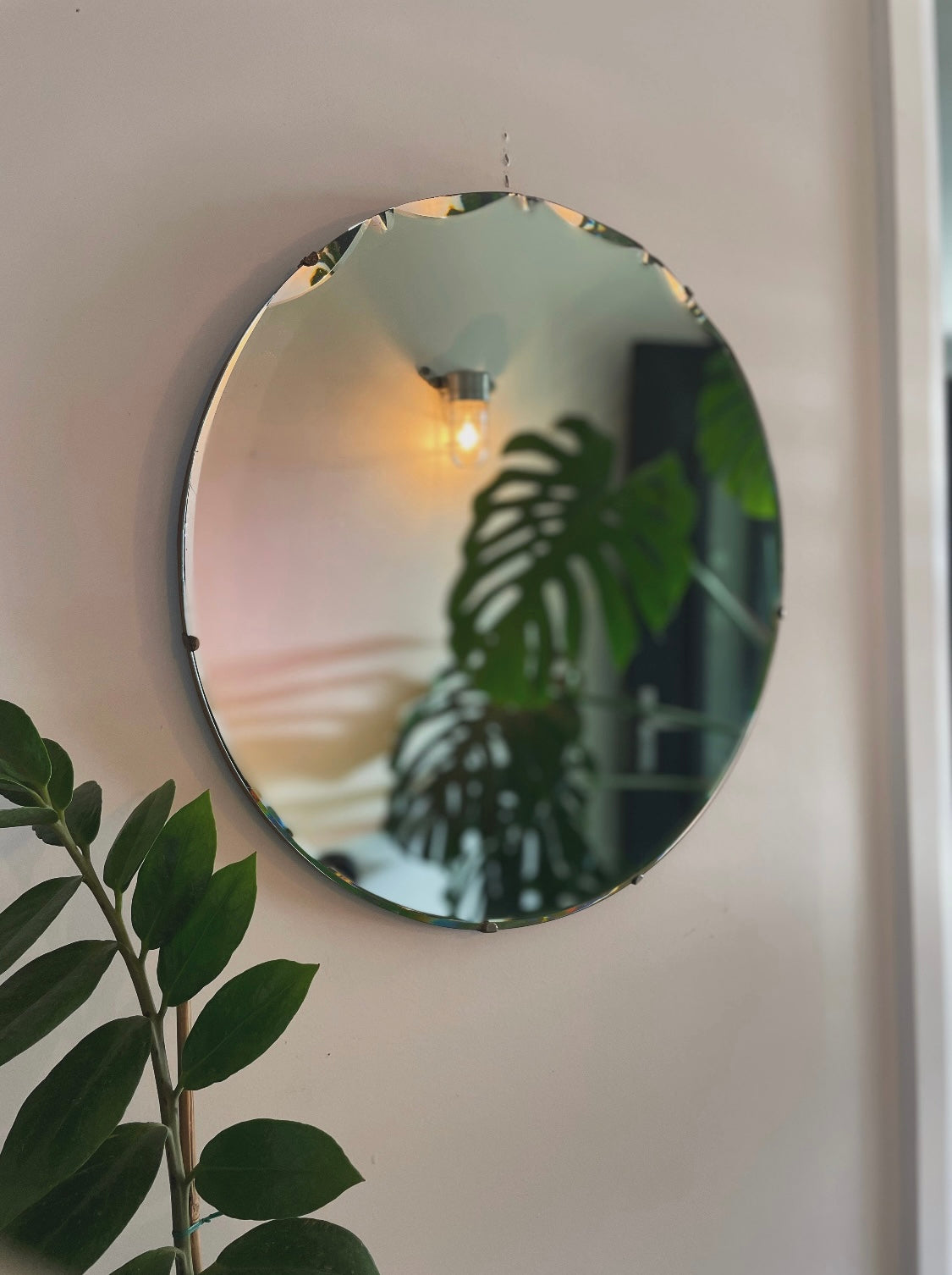 Large round antique Art Deco mirror with scalloped beveles