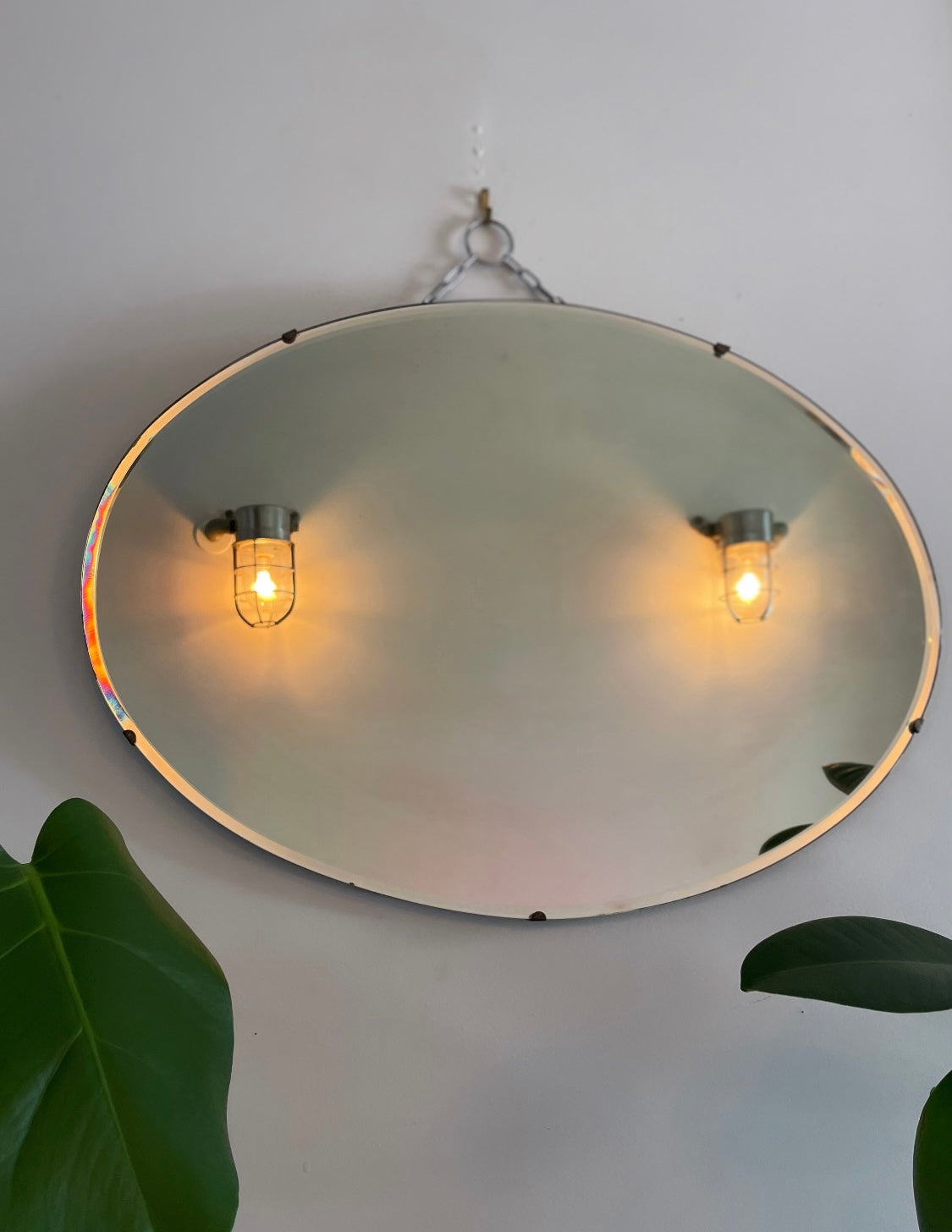 Antique oval Art Deco mirror with hanging chain