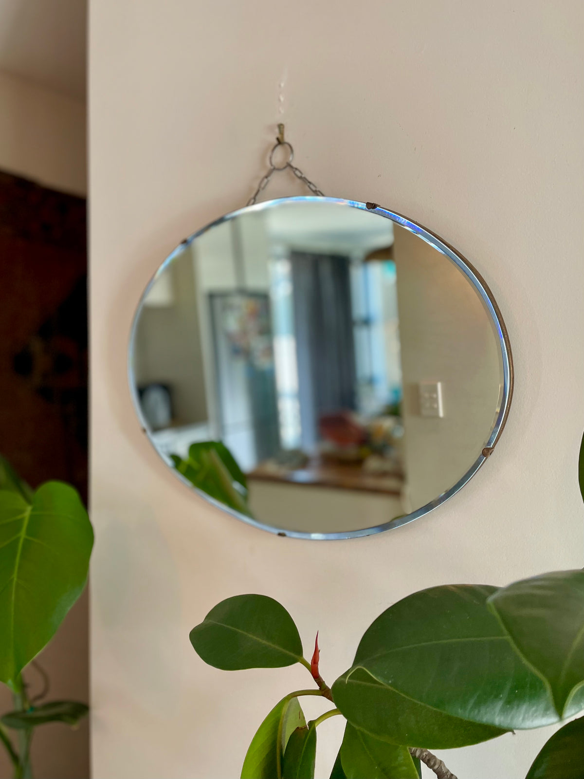 Antique oval Art Deco mirror with hanging chain
