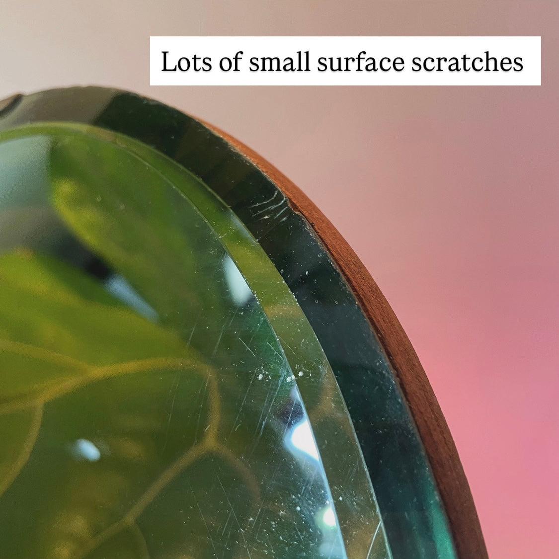 Small round antique mirror with rainbow catching beveles