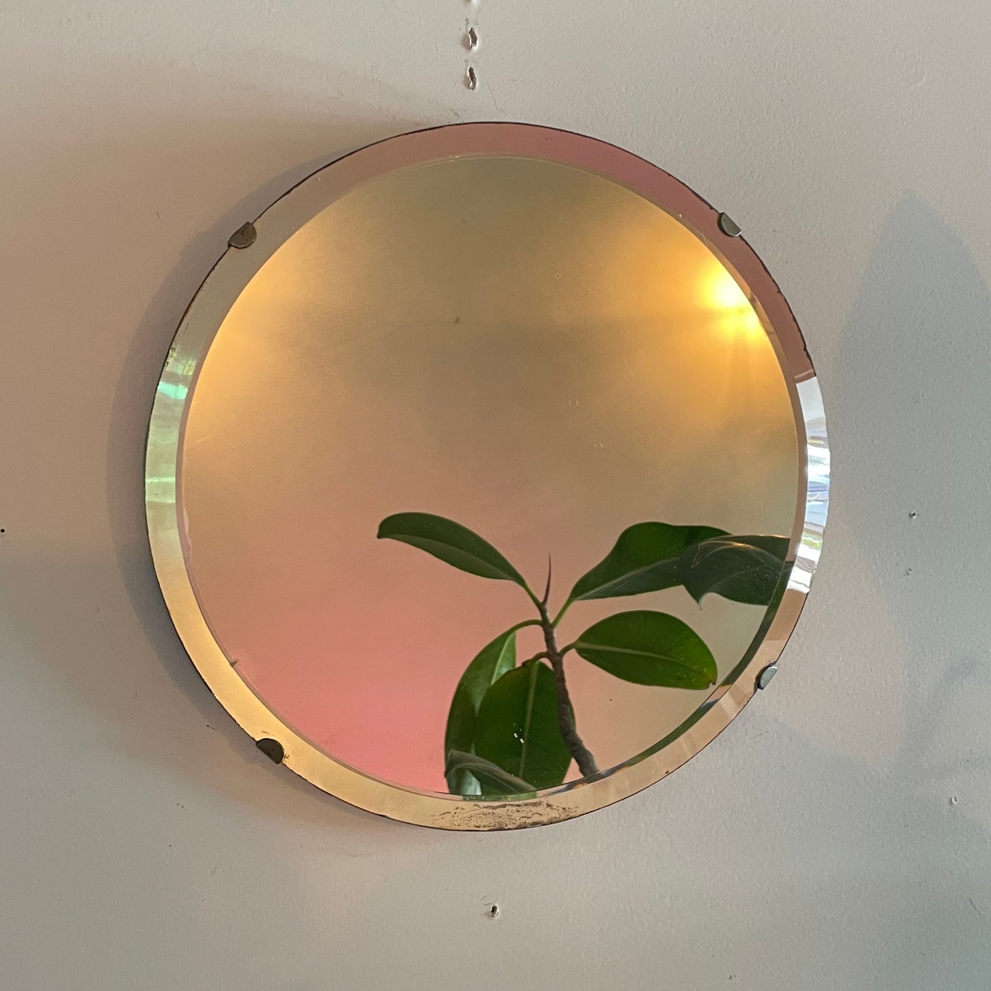 Small round antique mirror with rainbow catching beveles