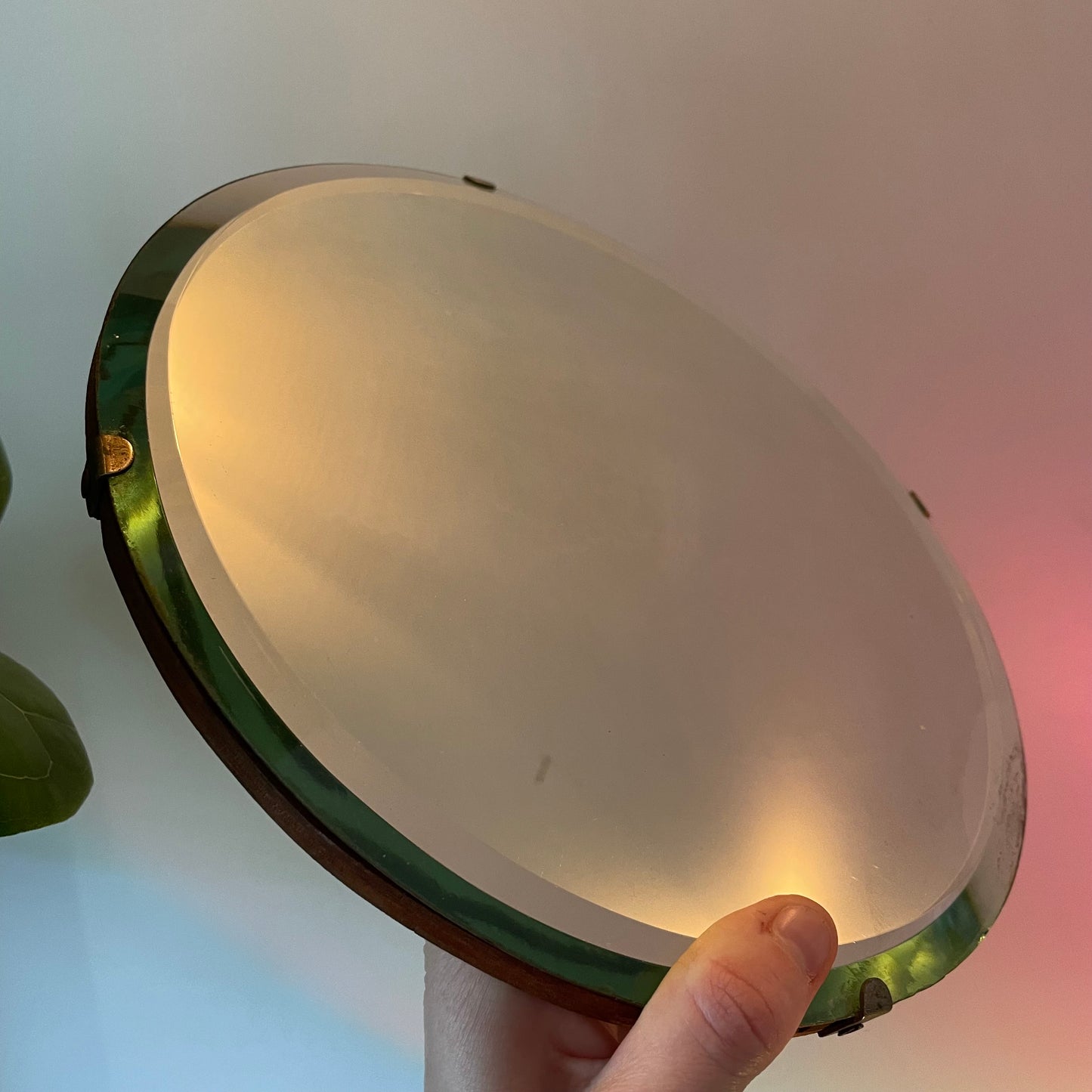 Small round antique mirror with rainbow catching beveles