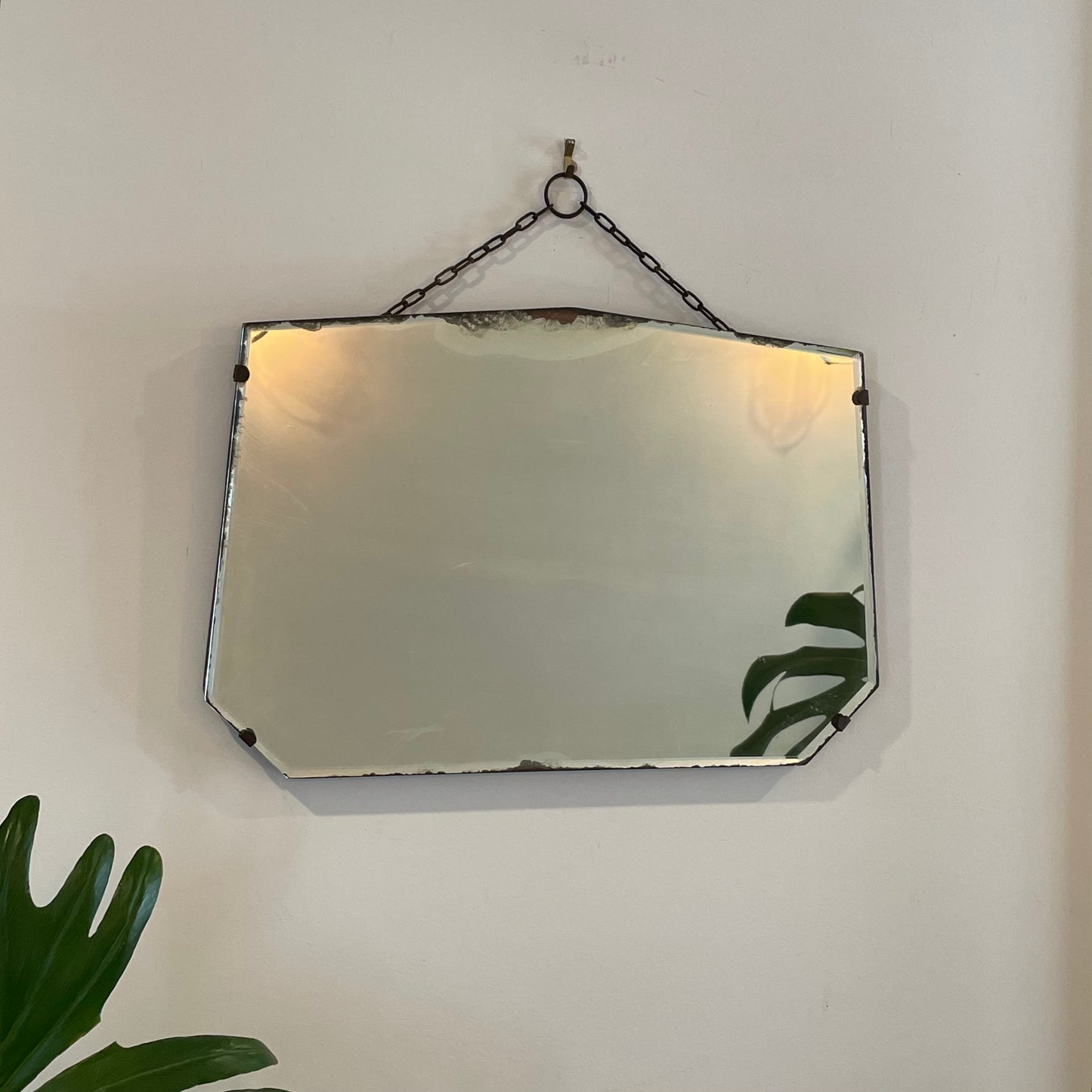 Antique frameless mirror with beveled edges and pointed top