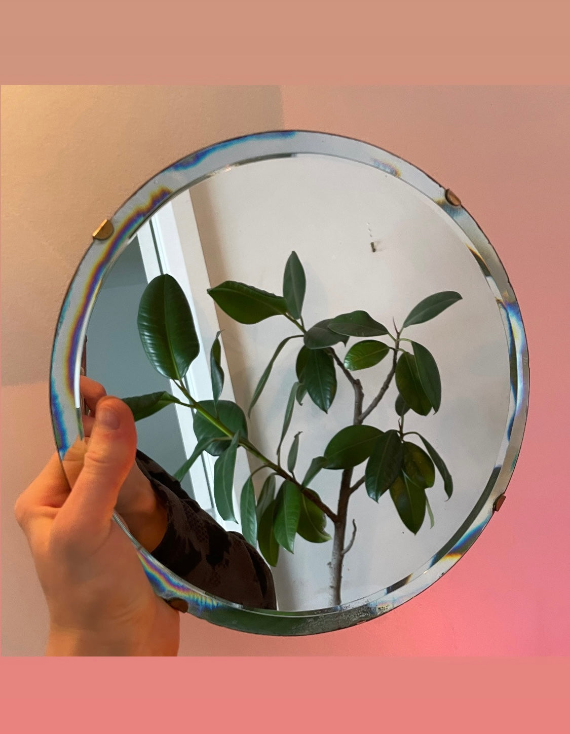 Small round antique mirror with rainbow catching beveles