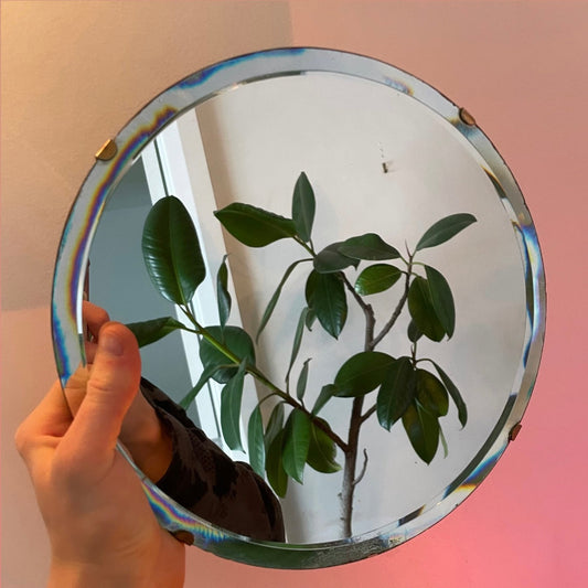 Small round antique mirror with rainbow catching beveles