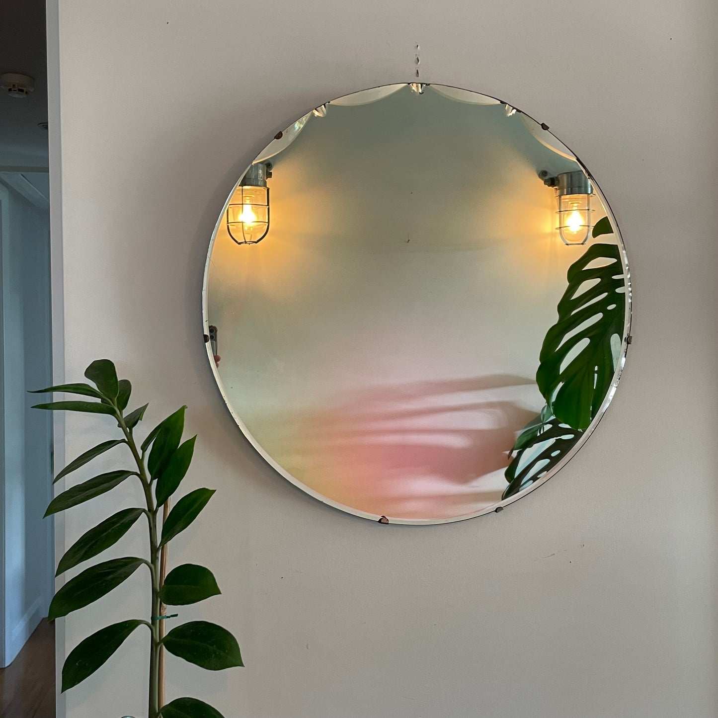 Large round antique Art Deco mirror with scalloped beveles