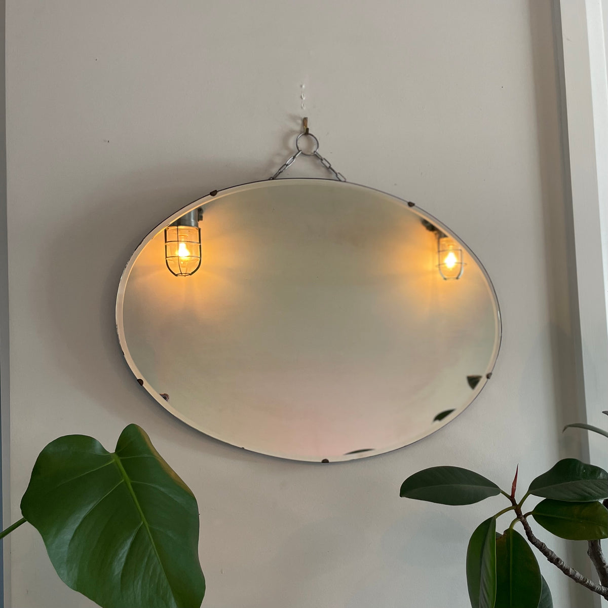 Antique oval Art Deco mirror with hanging chain