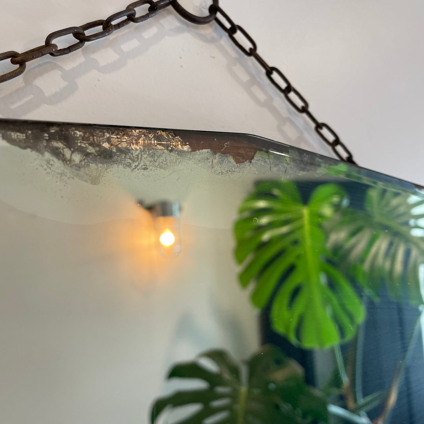 Antique frameless mirror with beveled edges and pointed top