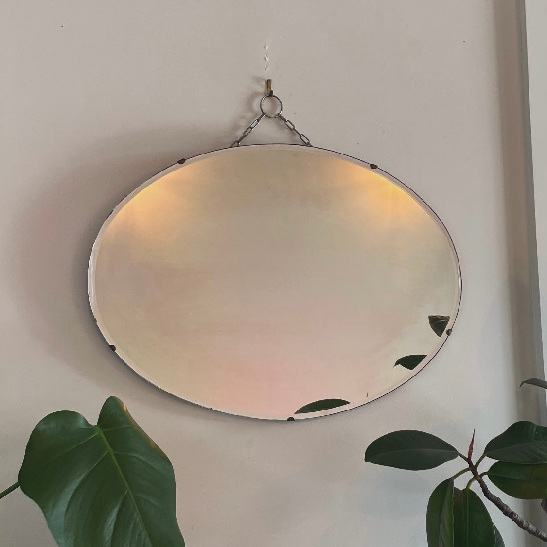 Antique oval Art Deco mirror with hanging chain