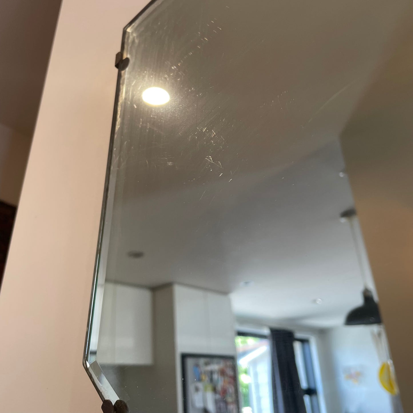 Antique frameless mirror with beveled edges and pointed top