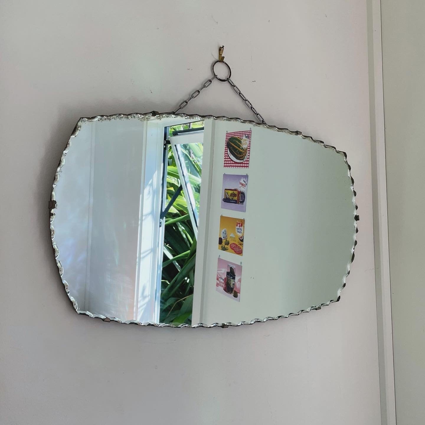 Art Deco oval mirror with pie crust edges