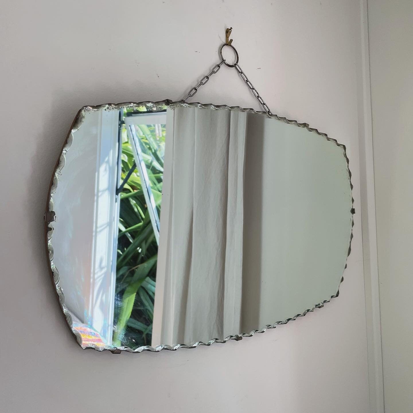 Art Deco oval mirror with pie crust edges