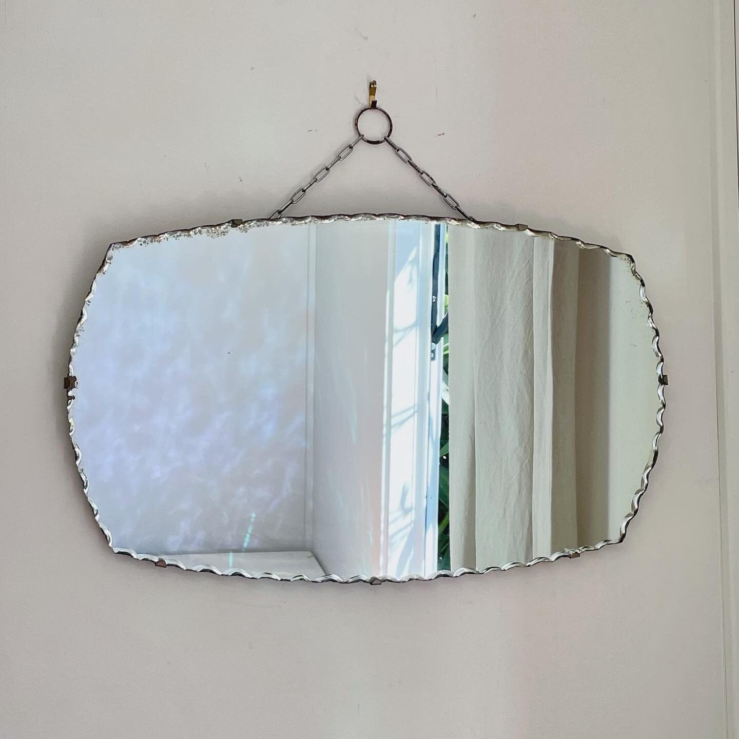 Art Deco oval mirror with pie crust edges