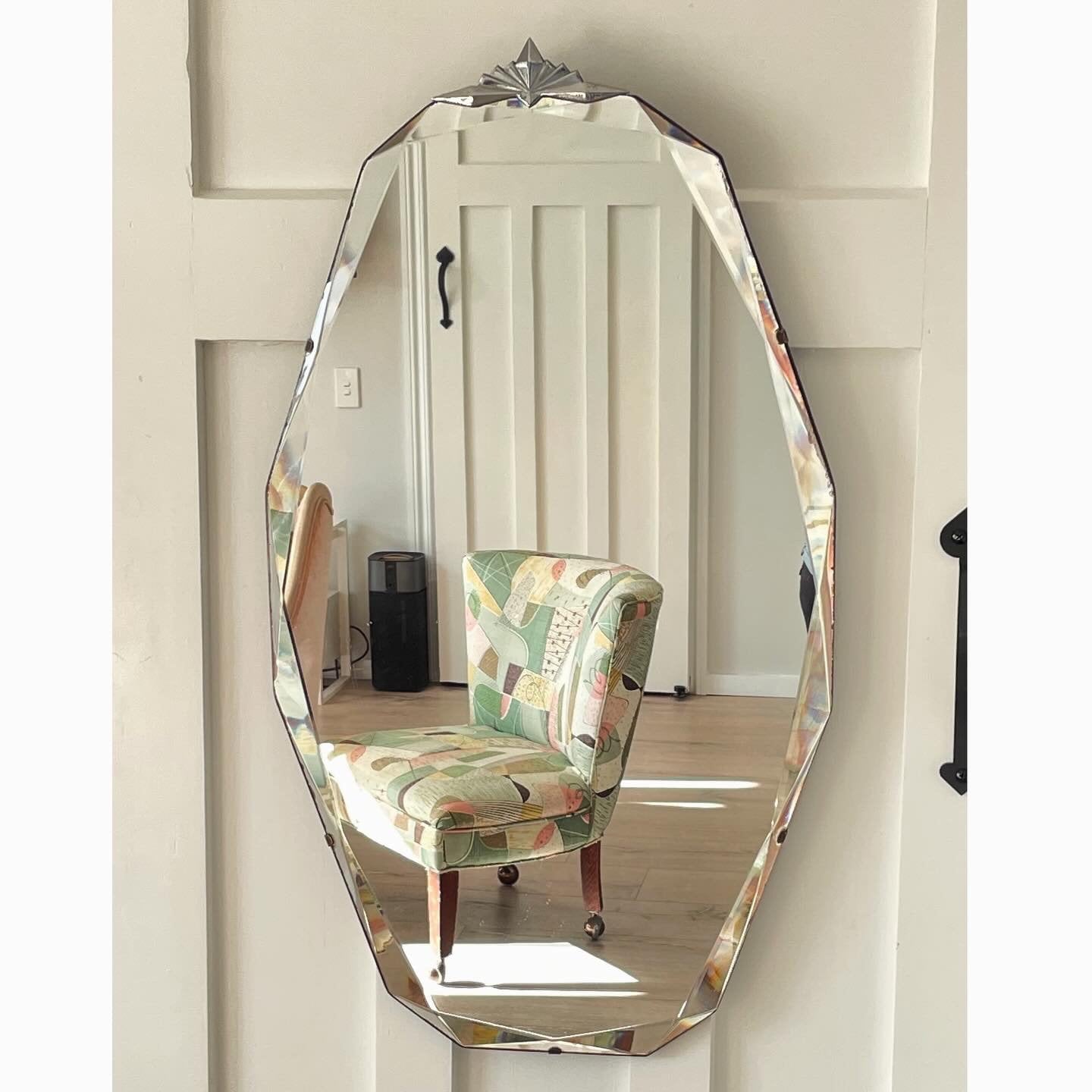 Stunning 12 sided Art Deco mirror with diamond faceted beveled edges and starburst crown topper